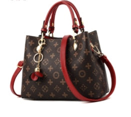 brown purse with red straps