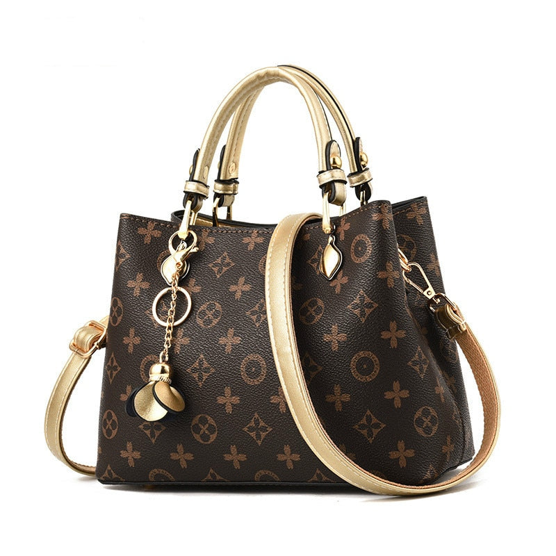 brown purse with gold straps