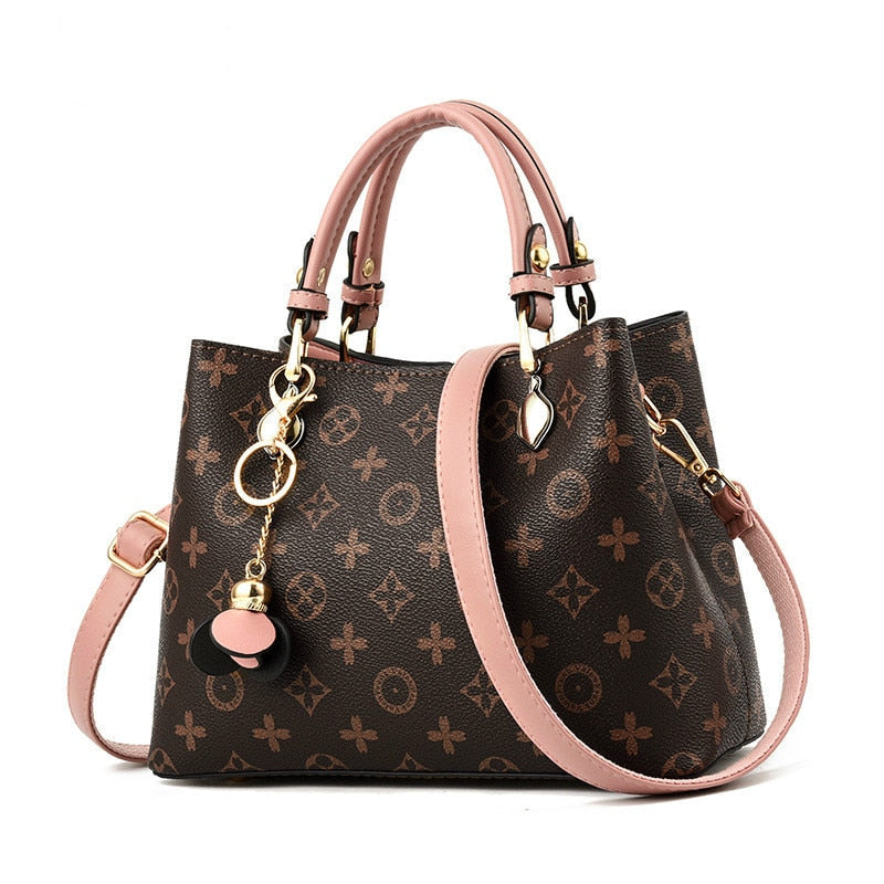 brown purse with pink straps