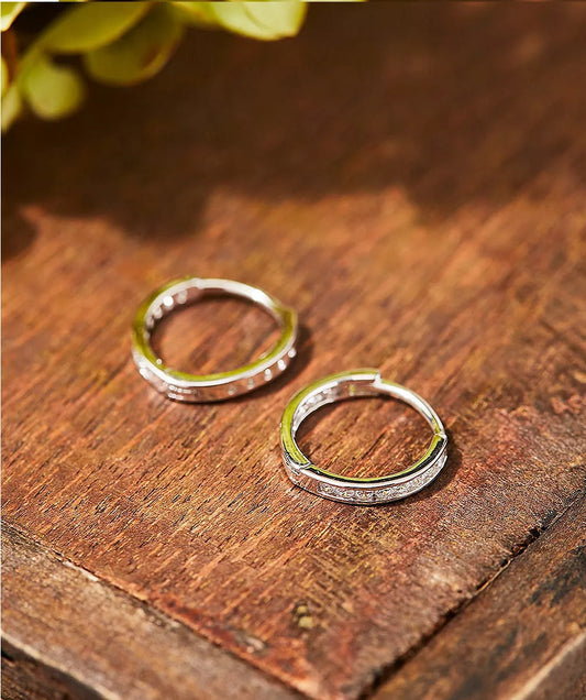 Earrings on a wooden table